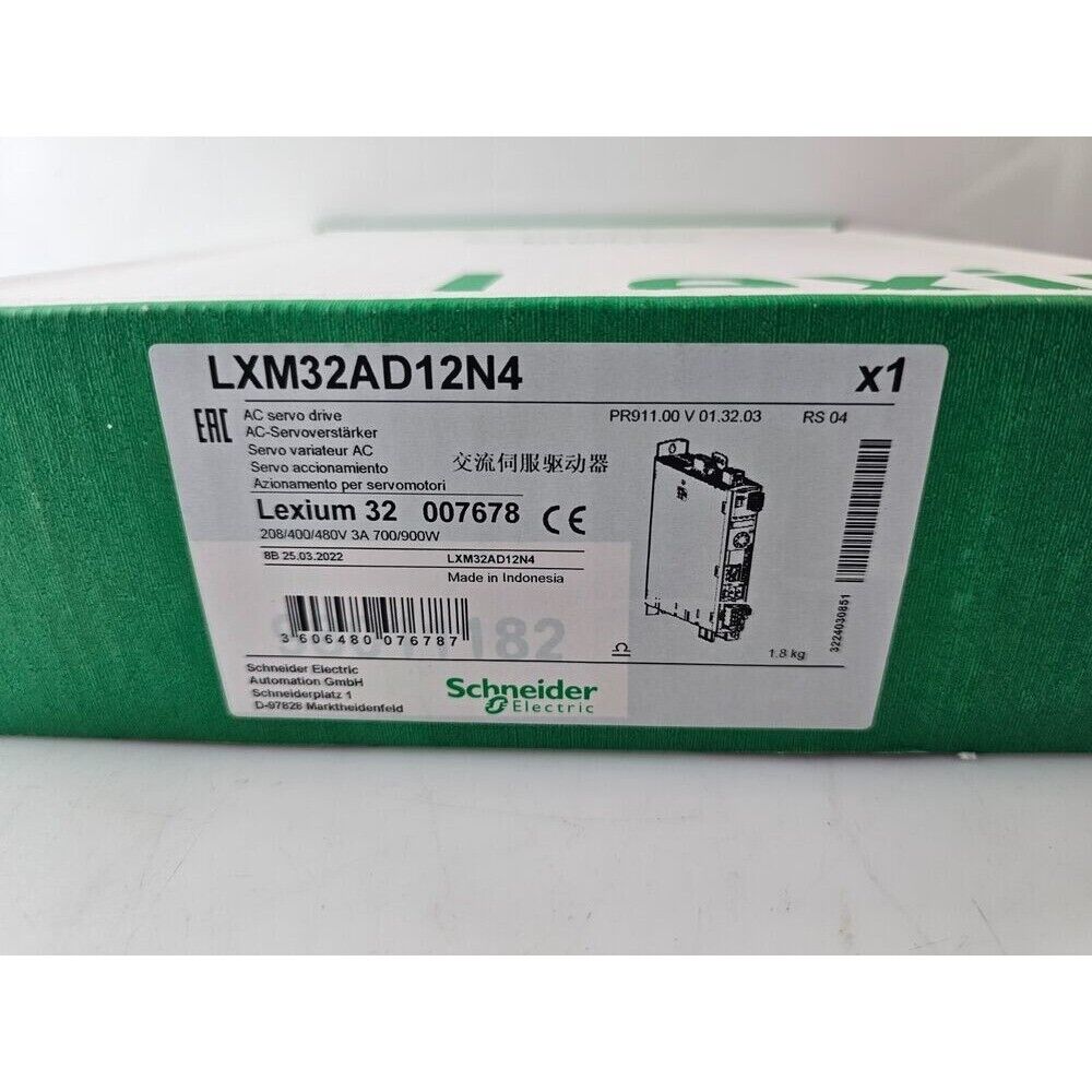 Schneider Electric LXM32AD12N4 Variable Frequency Drive (VFD) on green packaging, servo drive detail.