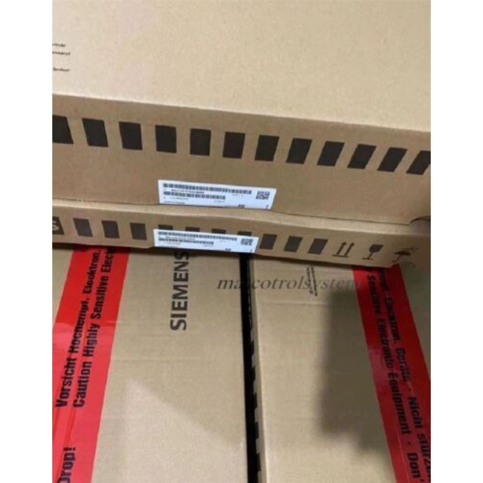 Siemens PLC industrial automation equipment packaging.  Caution labels on the box.