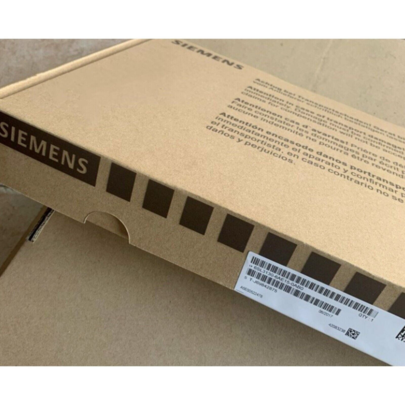 Siemens 6SL3130-6AE15-0AB0 Smart Line Module box with product details and warnings.