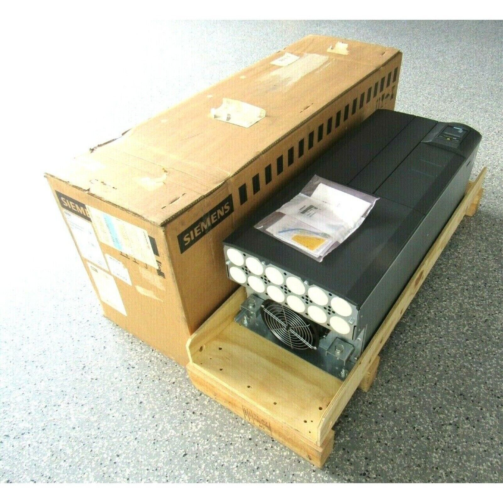Siemens MICROMASTER 430 drive, industrial automation part in box with Siemens logo, black drive in wooden crate