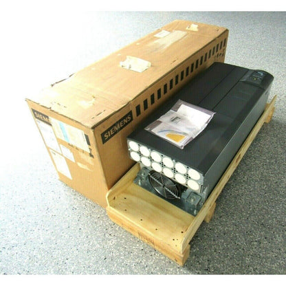 Siemens MICROMASTER 430 drive, industrial automation part in box with Siemens logo, black drive in wooden crate