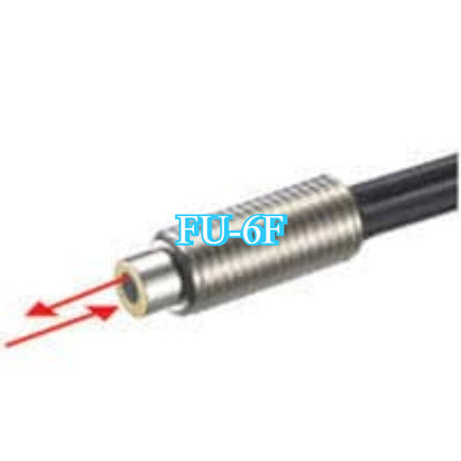 Keyence FU-6F fiber optic sensor. The image shows the metallic body of a sensor with red laser arrows.