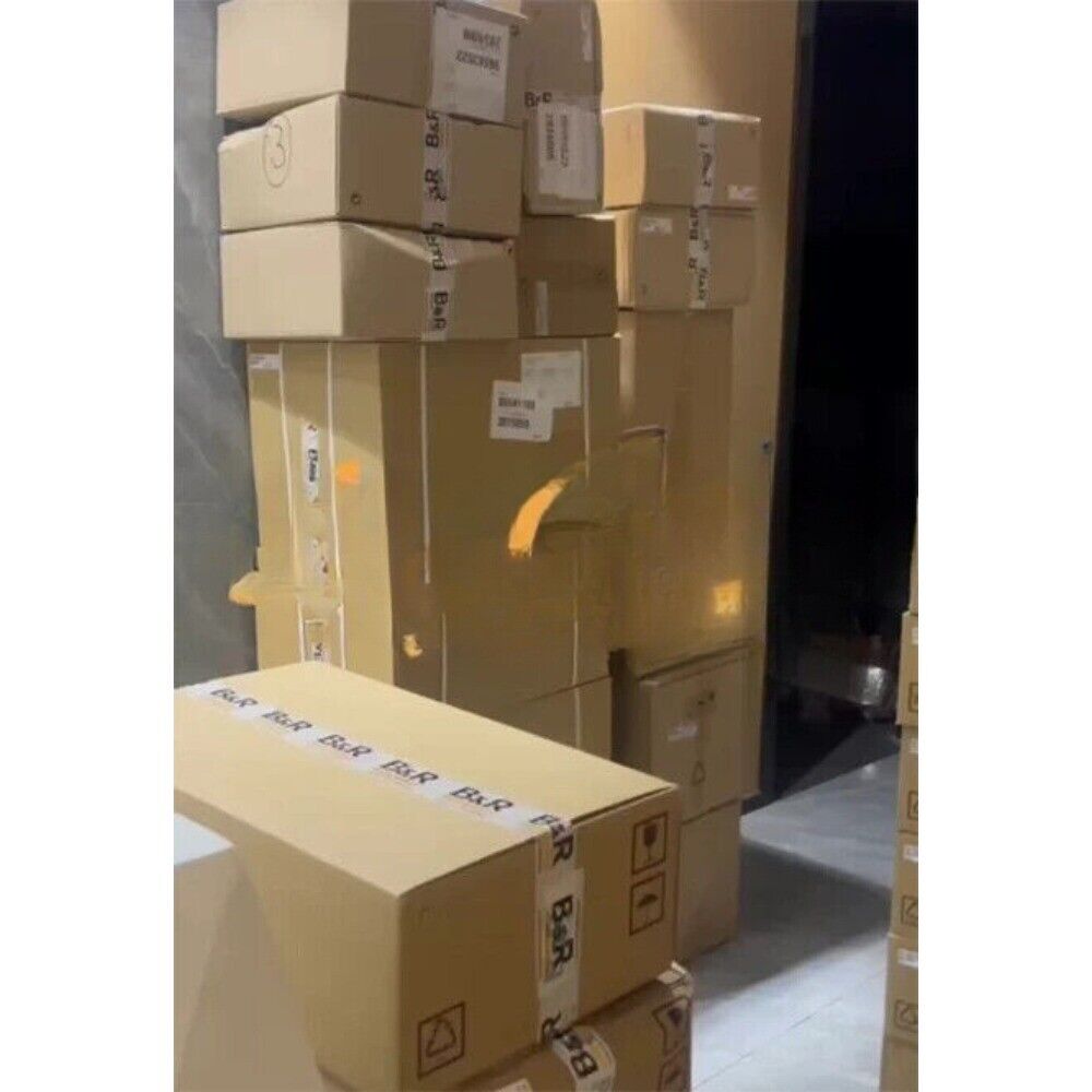 B&R servo motor boxes stacked, ready for expedited shipping. New in box industrial automation parts.