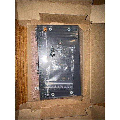 B&R 5DLSDL.1000-00 safety module, industrial automation part, in open cardboard box, with mounting screws.