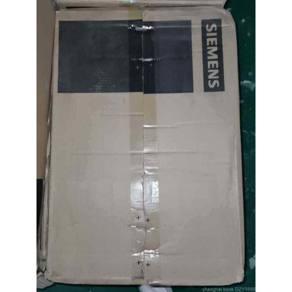 Siemens product box, industrial automation part, possibly PLC module. Cardboard packaging with branded logo.