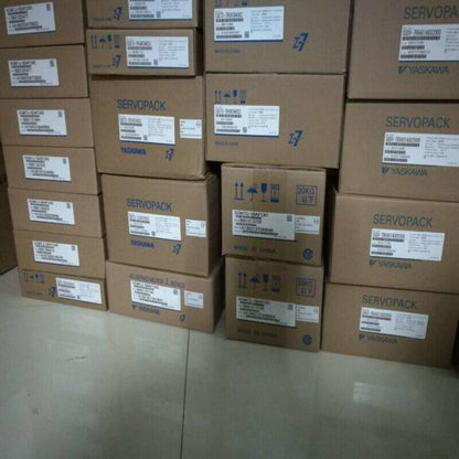 YASKAWA servo drive modules in boxes, SERVOPACK product, industrial automation components, expedited shipping available.