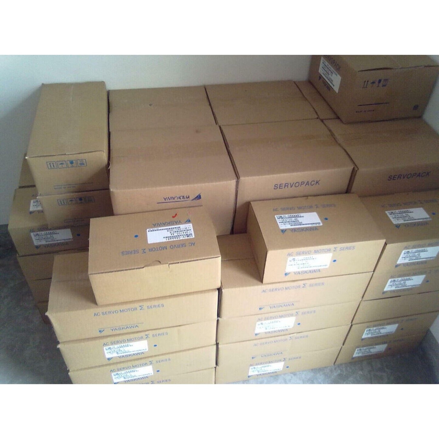 Yaskawa AC Servo Motors in boxes. New SGM-08V312 model industrial automation parts ready for shipping.