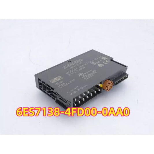 Siemens 6ES7138-4FD00-0AA0 PLC Module, industrial automation part, black with connectors.