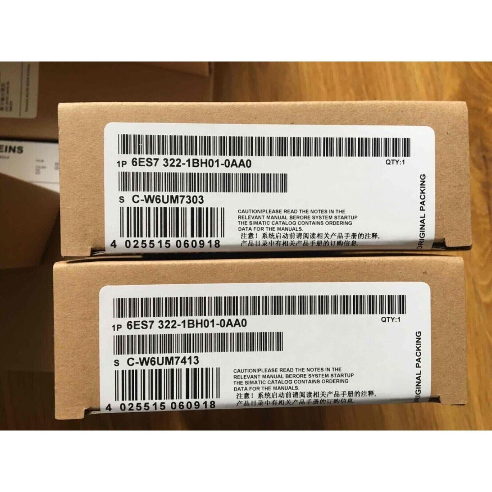 Two SIMATIC S7-300 6ES7 322-1BH01-0AA0 digital output modules packaging boxes with labels, industrial automation parts.