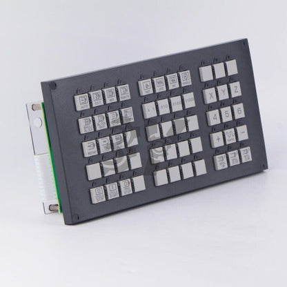 FANUC A02B-0303-C231 operation panel key with multiple function buttons, including AUTO, EDIT, and numeric keys.