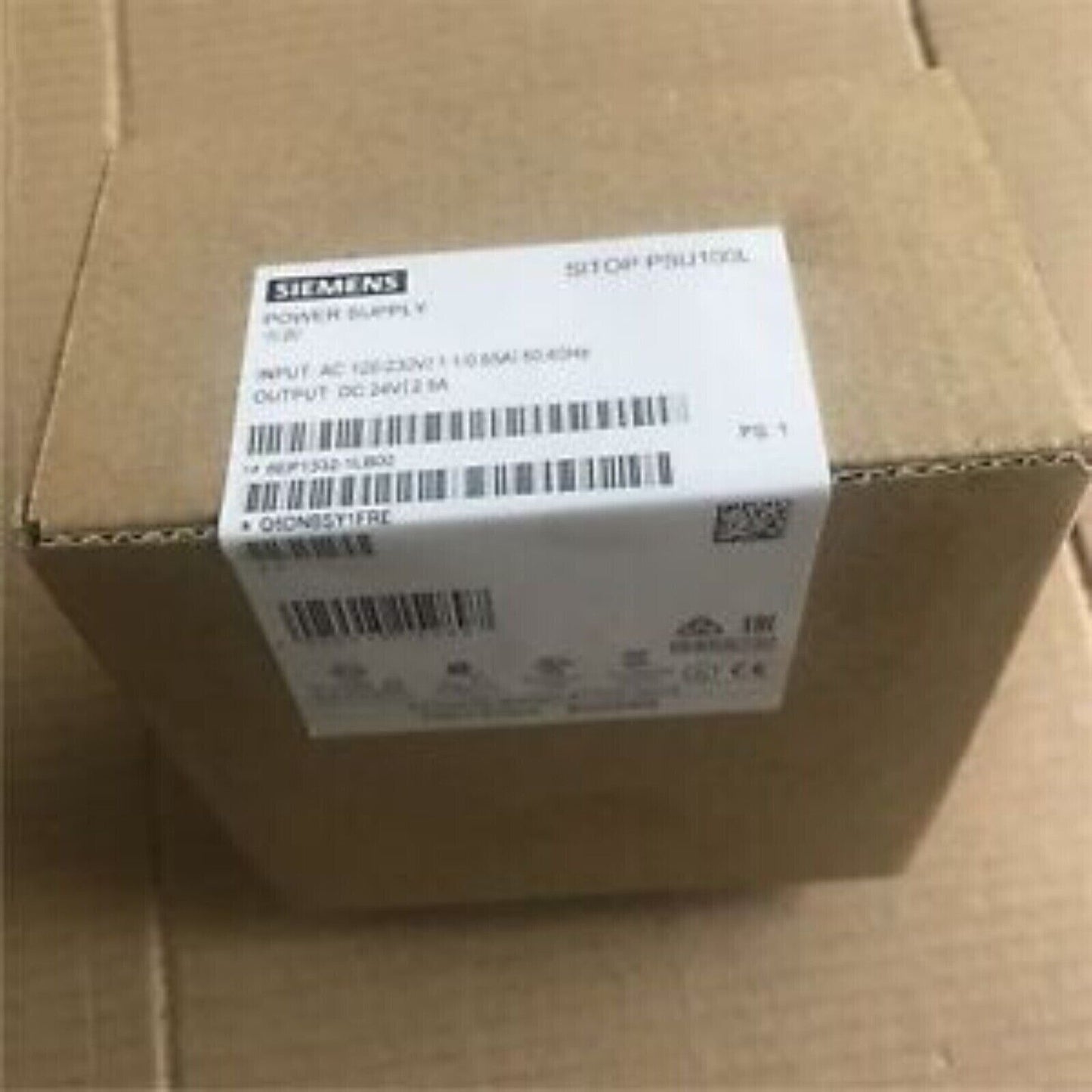 Siemens SITOP PSU100L power supply in box, industrial automation equipment.
