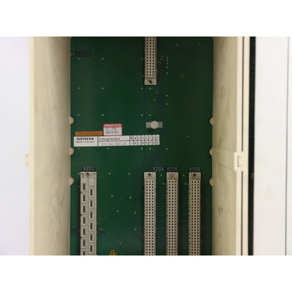 Siemens SINUMERIK 840C/840CE industrial automation part, beige unit, green circuit board with connectors.