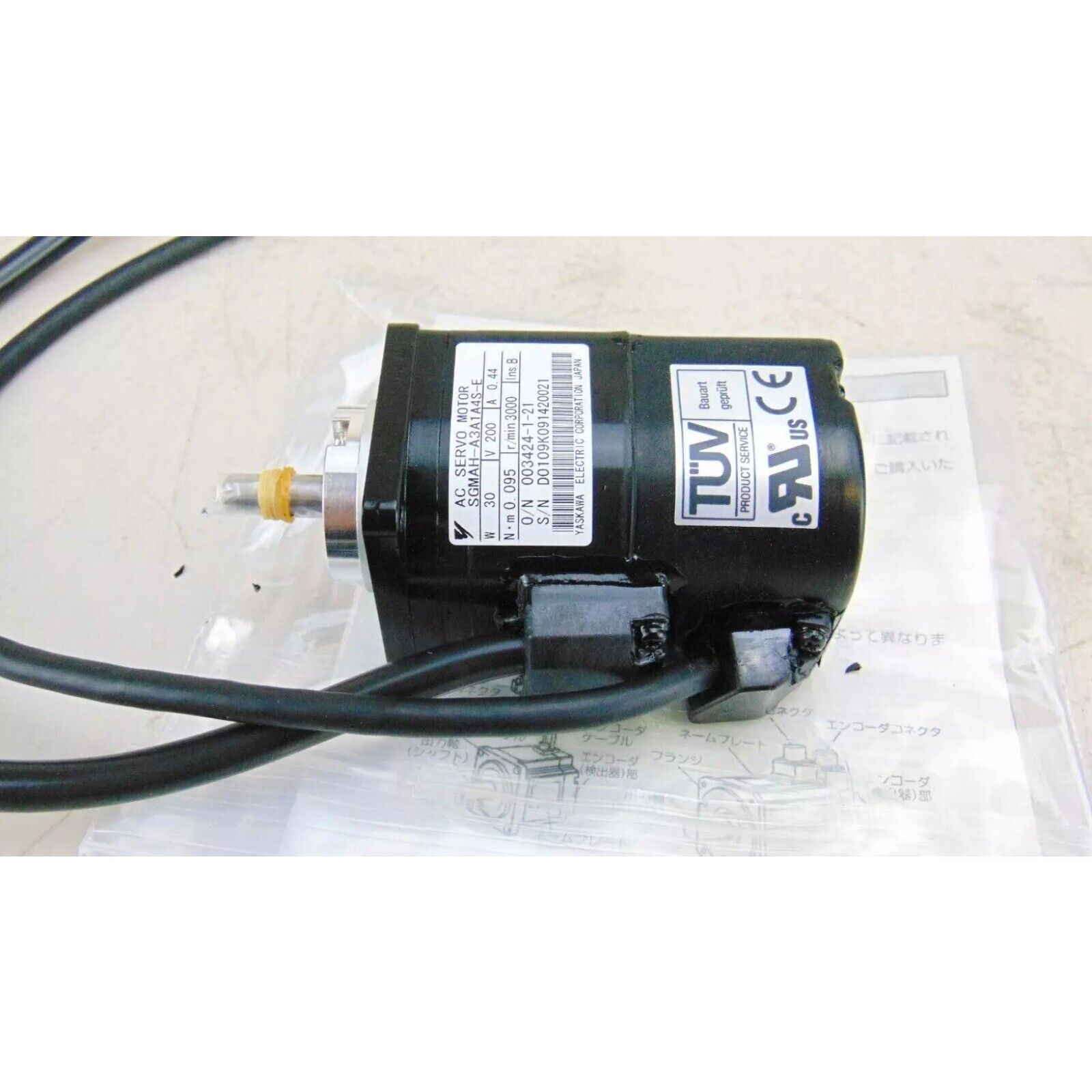 Yaskawa SGMAH-A3A1A4S-E AC Servo Motor, industrial automation part, with black body and cables.