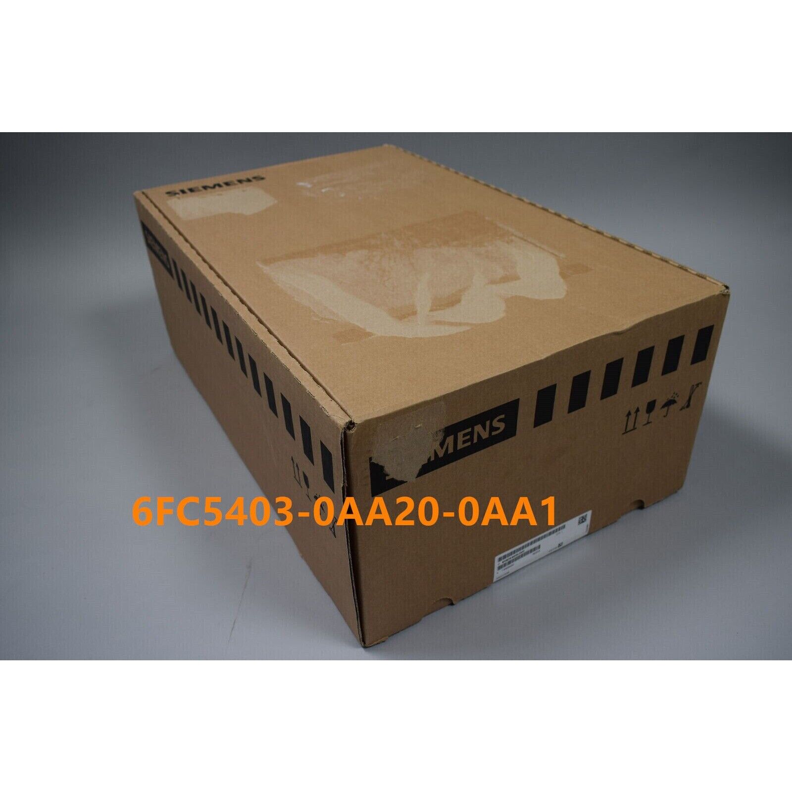Siemens 6FC5403-0AA20-0AA1 product box, brown cardboard with product information label for industrial automation.