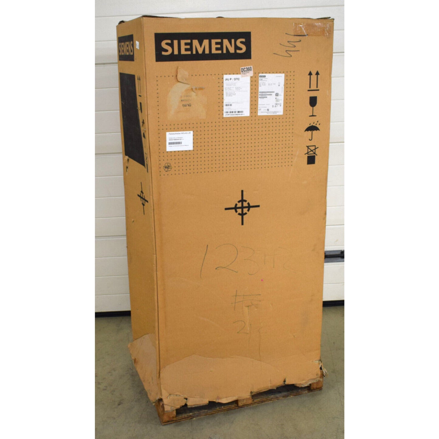 Siemens S120 Active Line Module shipping box. Brown cardboard box with Siemens logo and shipping labels, on a pallet.