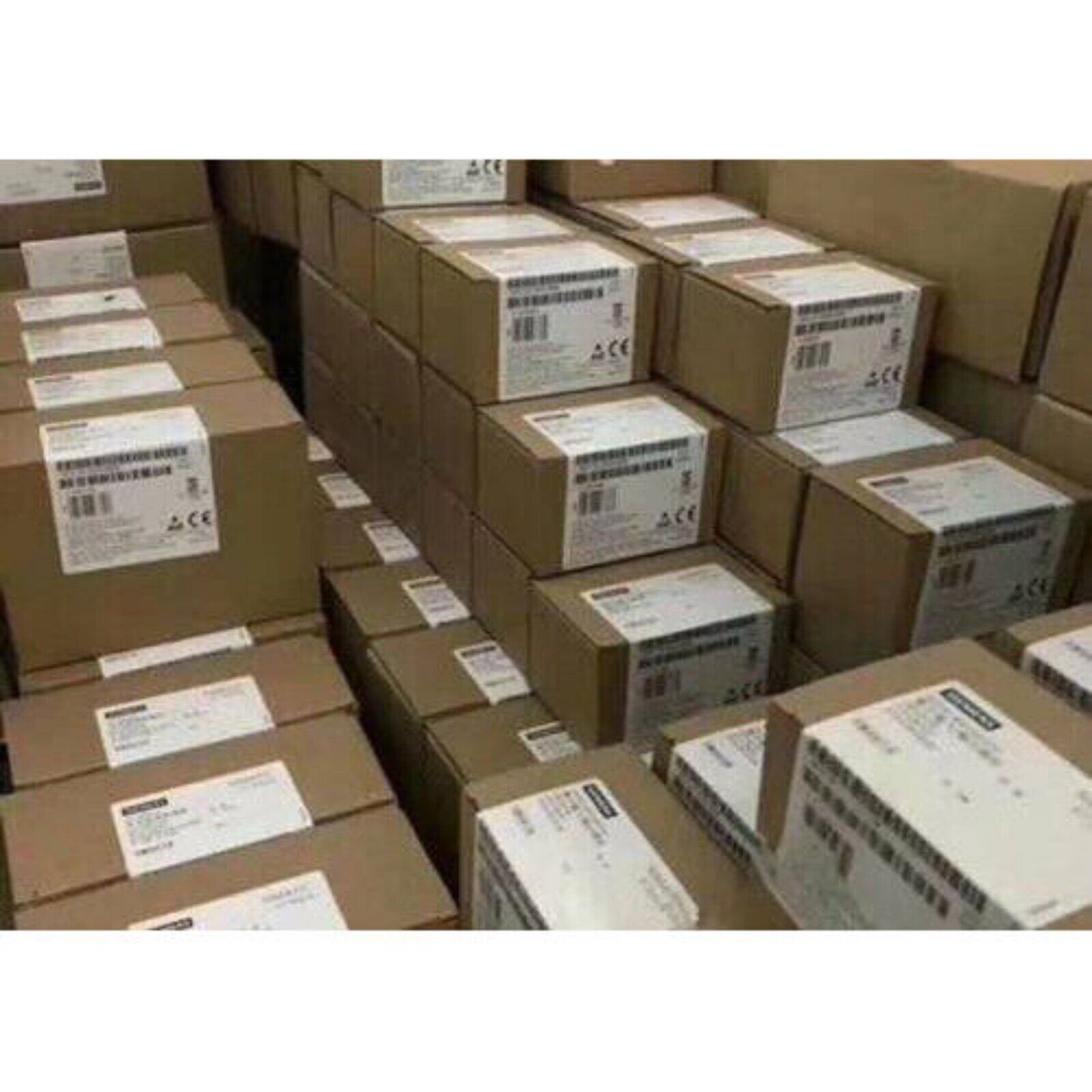 Siemens SINAMICS G120 Control Unit CU250S-2 boxes in warehouse, industrial automation components.