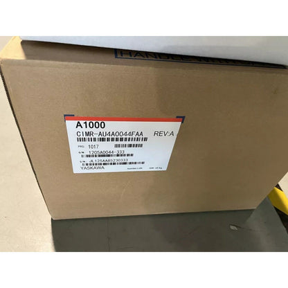 Yaskawa A1000 AC Drive in cardboard box. Model CIMR-AU4A0044FAA, industrial automation part, REV:A