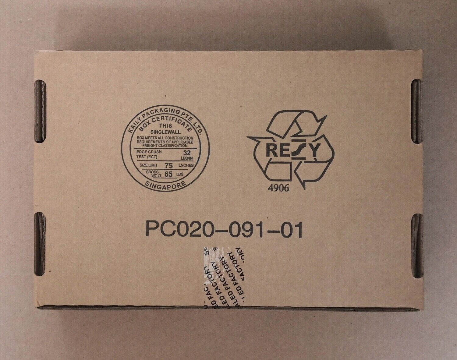 Cardboard box with product details and certifications, for Allen-Bradley 1746-NT8 SLC 500 module, made in Singapore.
