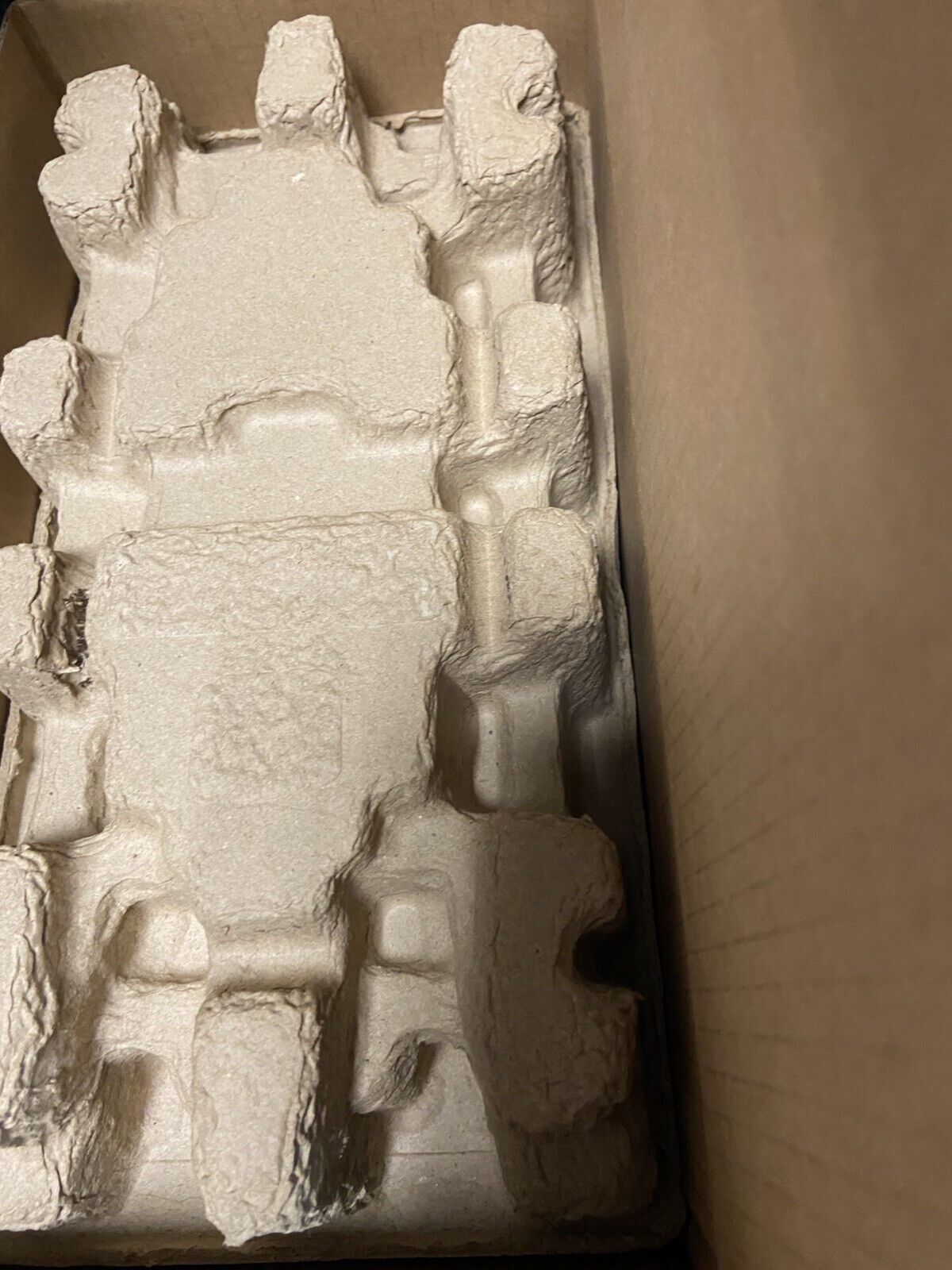 Protective cardboard packaging for PowerFlex 525 AC Drive, brown molded pulp insert inside a cardboard box.