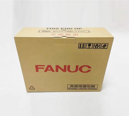 FANUC servo drive packaging box, brown cardboard, with text 'THIS END UP', '天地無用' and 'REUSABLE CARTON PACKAGE'.