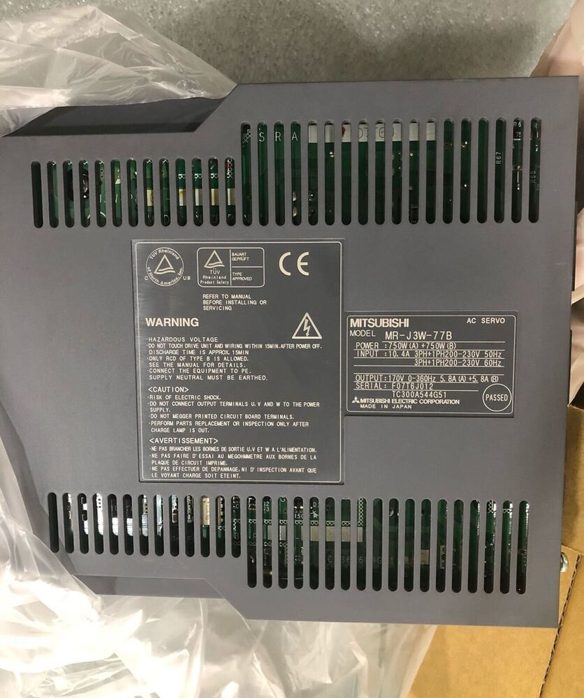 Mitsubishi MR-J3W-77B AC Servo Drive rear view, industrial automation part. Warning labels, model information.