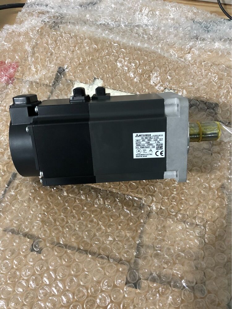 Mitsubishi HG-KN73BJ-S100 AC servo motor in bubble wrap. Industrial automation part, made in Japan.