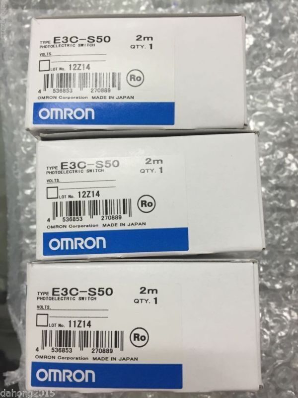 Omron E3C-S50 Photoelectric Switch boxes, new in box, showing product details.