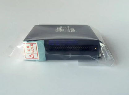 New Mitsubishi Q173PX CPU Module, Industrial PLC automation part in original packaging, Caution label.