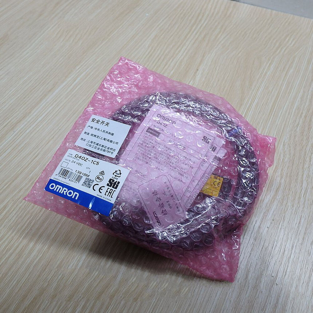 New OMRON D40Z-1C5 Door Switch 24VDC in pink protective packaging. Industrial automation sensor part.