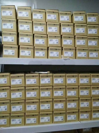 Mitsubishi FX2N-48MR-DS PLC Modules in boxes stacked on shelves