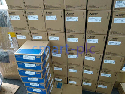 Mitsubishi PLC and Servo Amplifier product boxes in warehouse, smart-plc parts