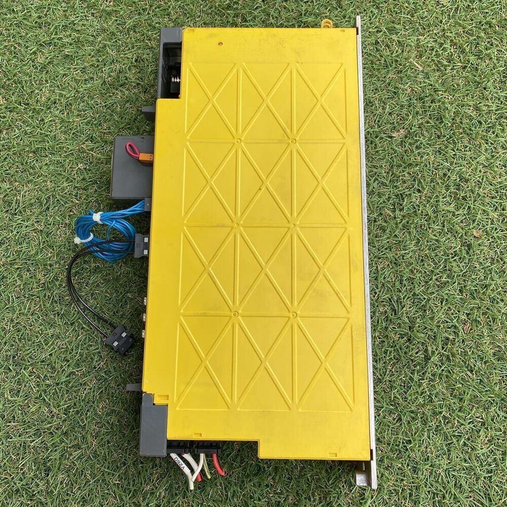 FANUC A06B-6117-H205 Servo Amplifier, yellow casing, with connectors and cabling details, industrial automation part.