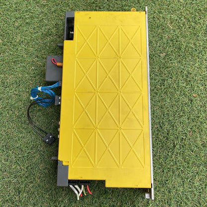 FANUC A06B-6117-H205 Servo Amplifier, yellow casing, with connectors and cabling details, industrial automation part.