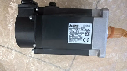 Mitsubishi HG-KN43J-S100 servo motor, 400W, black and silver industrial automation part