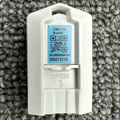 ABB ACS880-MU-ZCU-12/14 ZMU-02 Inverter Memory Card, White Plastic Enclosure with Label, Open Indicator.