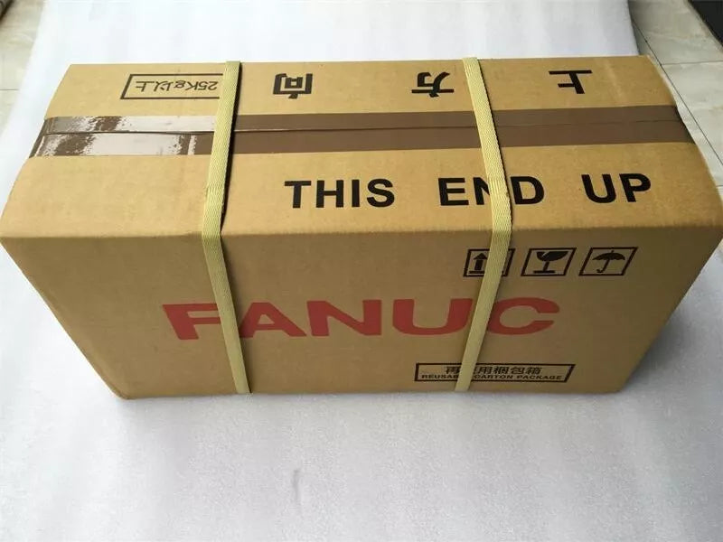 FANUC A06B-0034-B077 Servo Motor shipping box, brown cardboard with text 'THIS END UP' and 'FANUC'