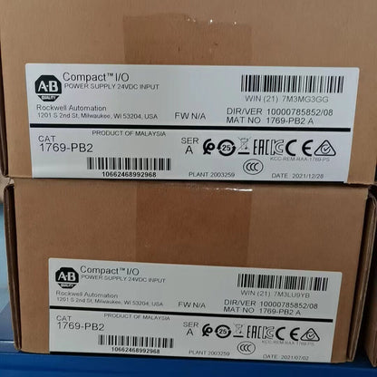 Allen-Bradley 1769-PB2 Compact I/O Power Supply boxes, labeled with specifications.