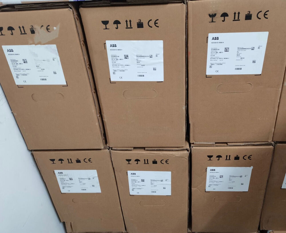 Stacked ABB ACS580-01 Inverter boxes, showing product labels with technical specifications, brown cardboard material