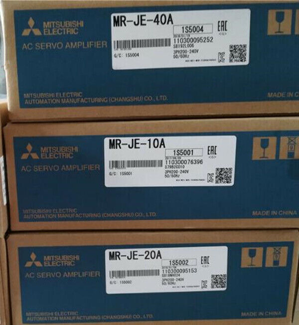 Mitsubishi MR-JE-40A Servo Drive boxes, AC Servo Amplifier, featuring product information labels.