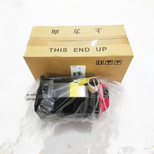 FANUC A06B-0034-B075#0008 Servo Drive in packaging, "THIS END UP" label on box, industrial automation part.