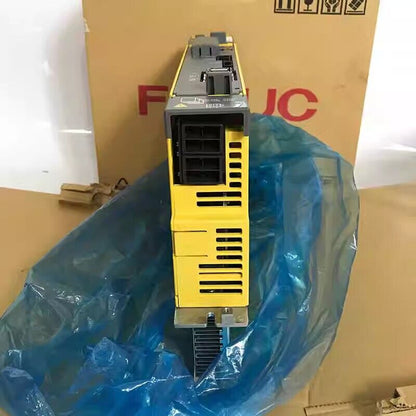 FANUC A06B-6114-H210 servo drive unit, yellow and gray, industrial automation component.
