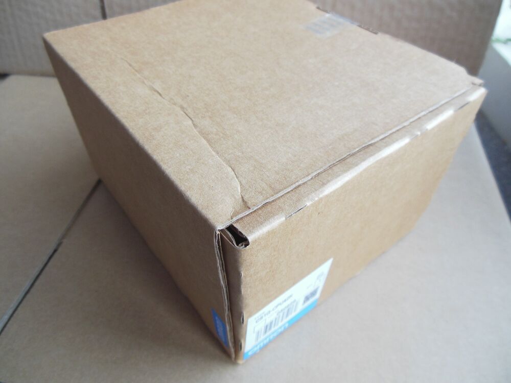 New Omron CS1G-CPU42H PLC in its original cardboard box, product packaging, fast shipping.