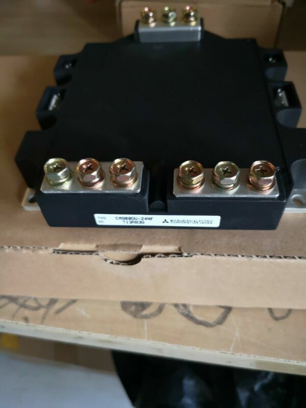 Mitsubishi CM900DU-24NF Inverter Module. Industrial automation part with multiple terminals, black body.