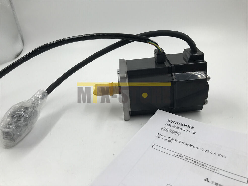 Mitsubishi HC-MFS23 AC Servo Motor, black industrial motor with documentation.
