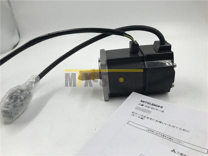 Mitsubishi HC-MFS23 AC Servo Motor, black industrial motor with documentation.