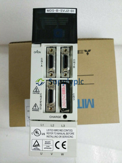 Mitsubishi MDS-B-SVJ2-01 Servo Drive Unit, industrial automation part, featuring multiple ports and safety labels, in box.