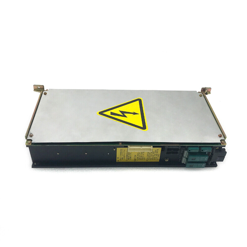 FANUC POWER UNIT A16B-1212-0100-01. Industrial automation component with warning label. High voltage caution.