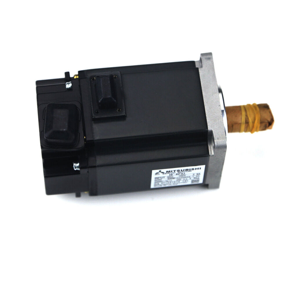 Mitsubishi HF-KP43 Servo Motor. Black body, silver end. Industrial automation equipment for sale.