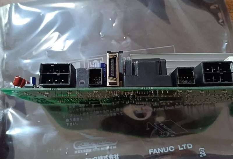 FANUC A20B-2101-0390 control board showing connectors and components, PLC spare part.