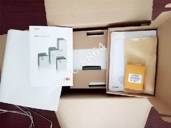 ABB DCS550-S01-0470-05-00-00 DC Drive unboxing, with product documentation and accessories.